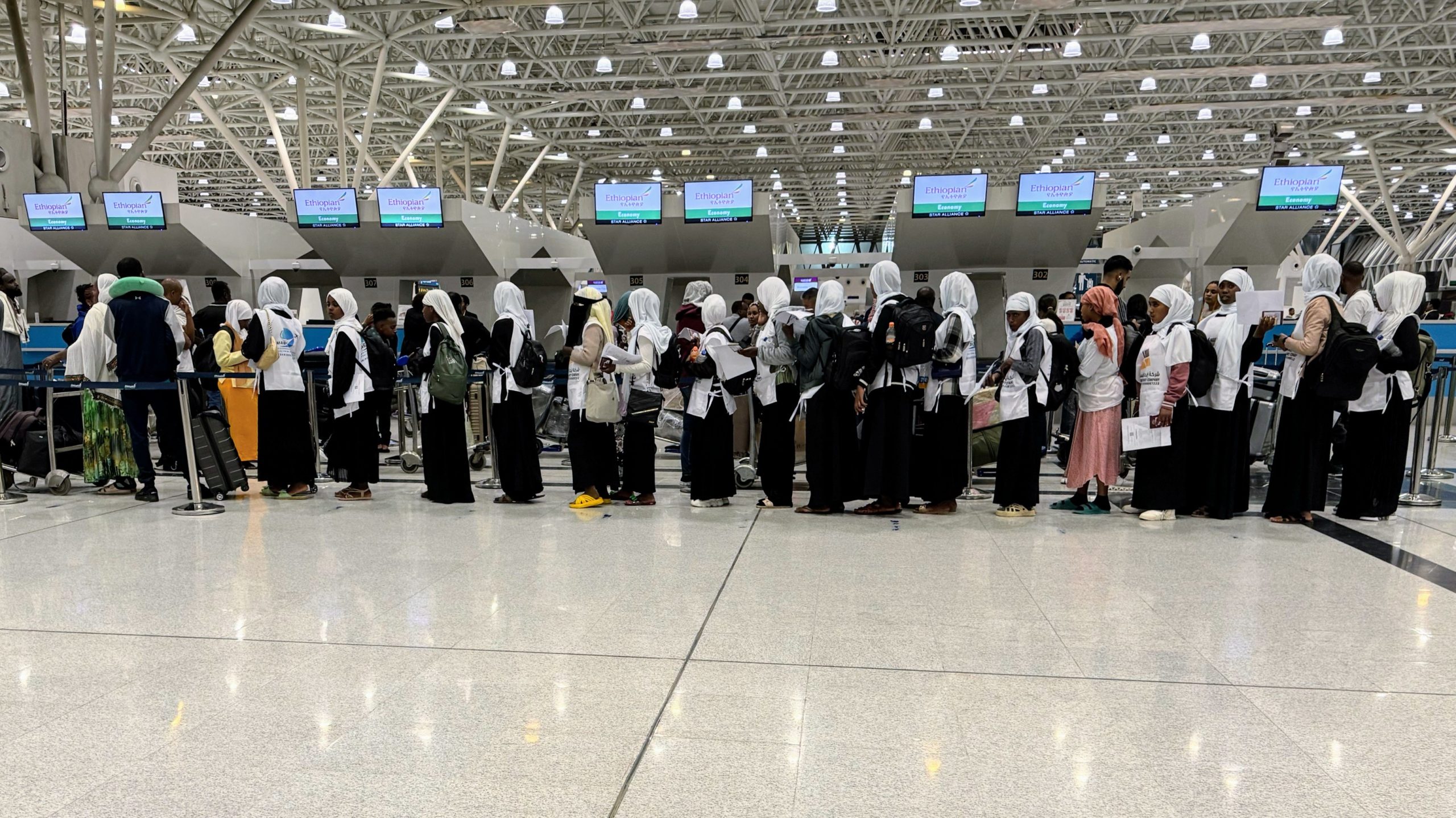 International labour migrants waiting in a queue at Addis Ababa Bole International Airport, October 2024